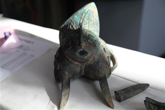 A Chinese archaistic bronze jue vessel and cover, 29cm, damage
